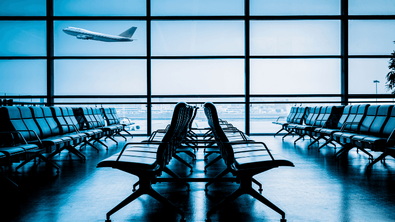 Modern airport terminal interior with travelers