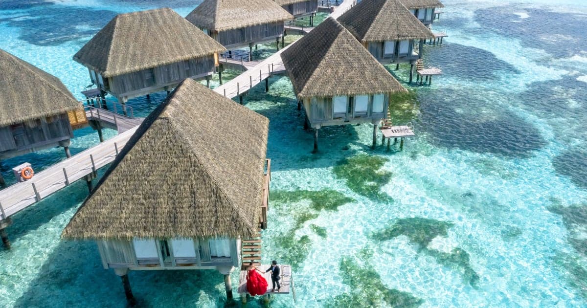 Romantic couple on honeymoon vacation with tropical beach destination