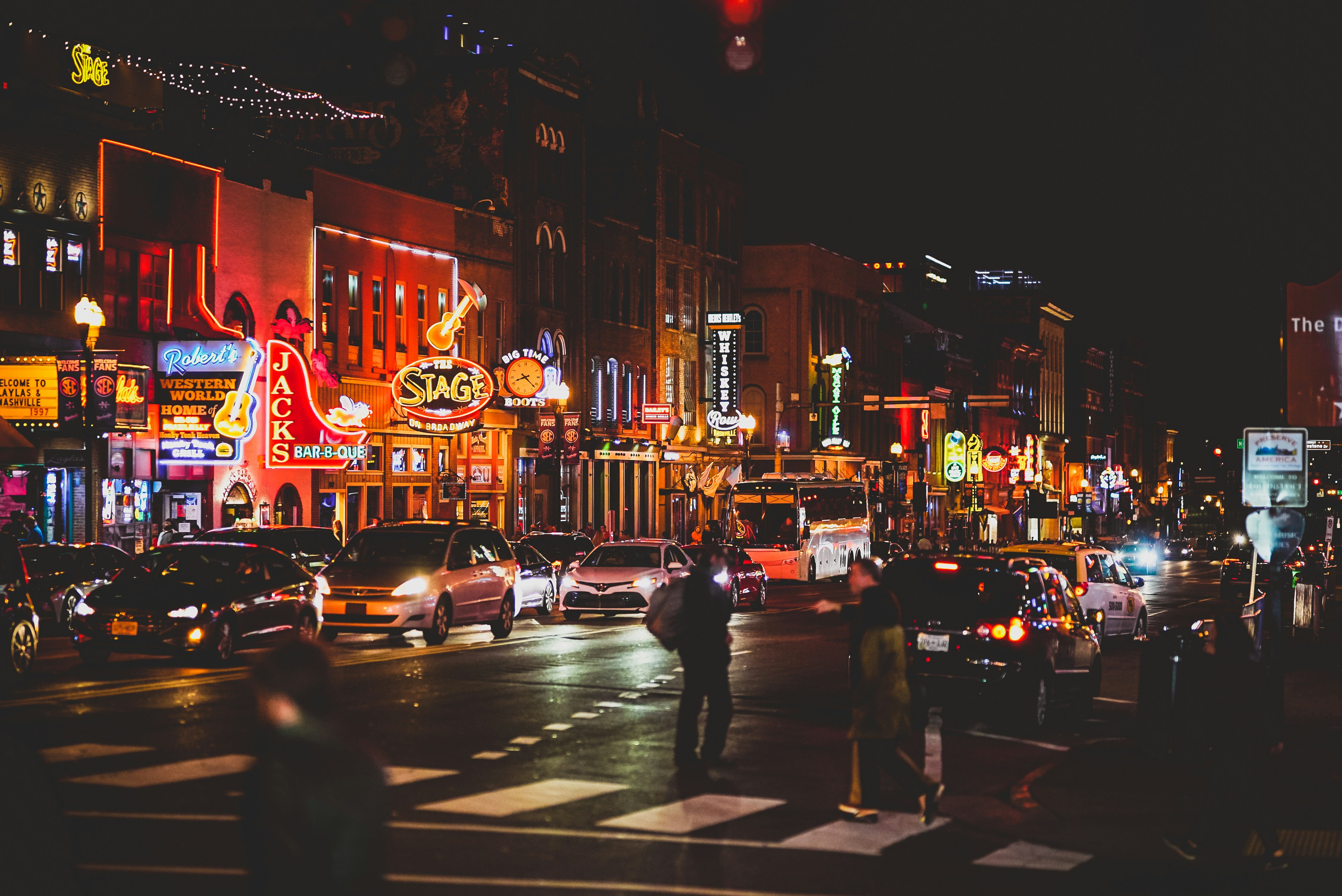 Broadway Street in Nashville with neon signs and honky tonks at night