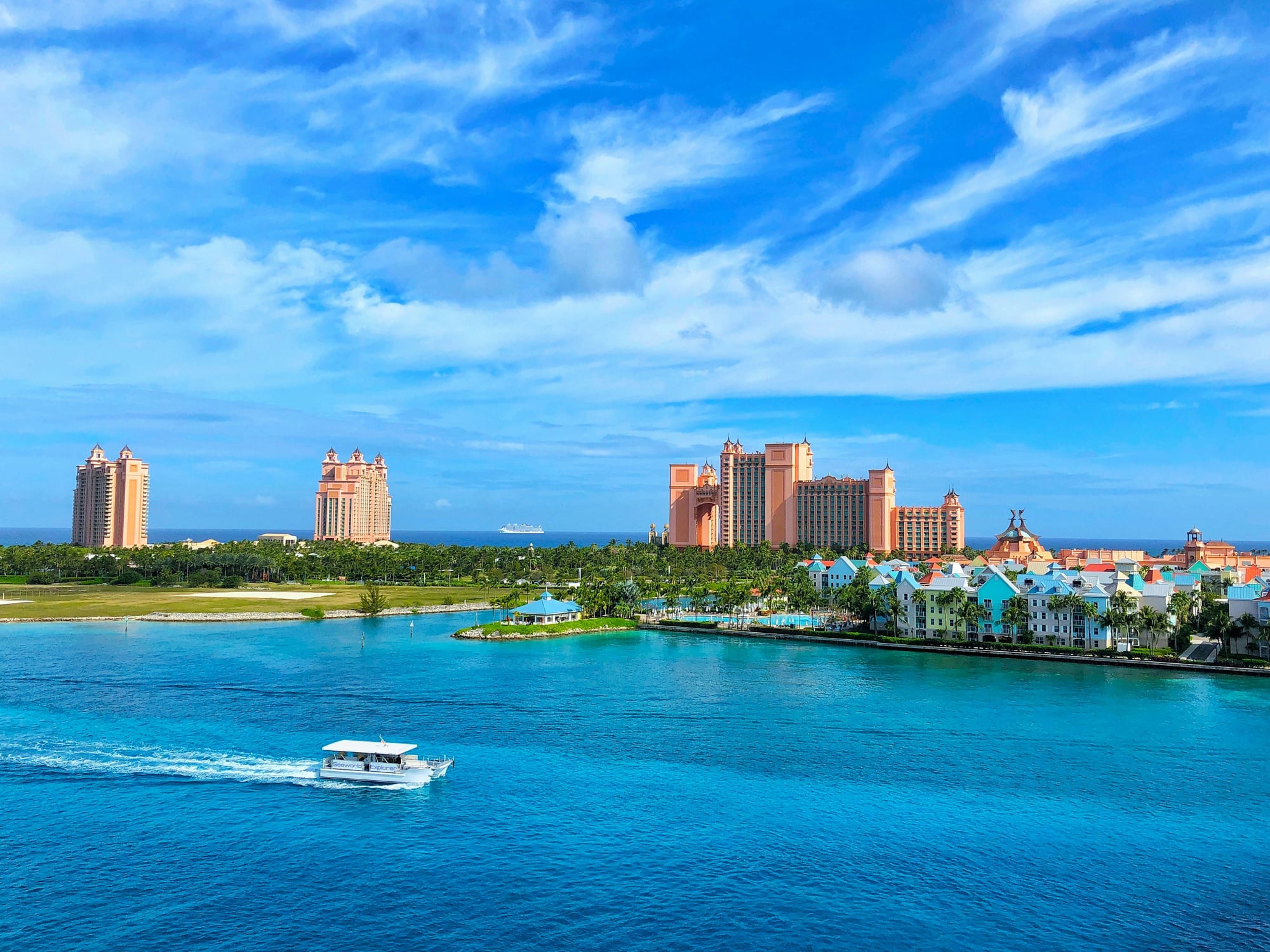 Nassau Bahamas Atlantis resort with turquoise harbor and boat